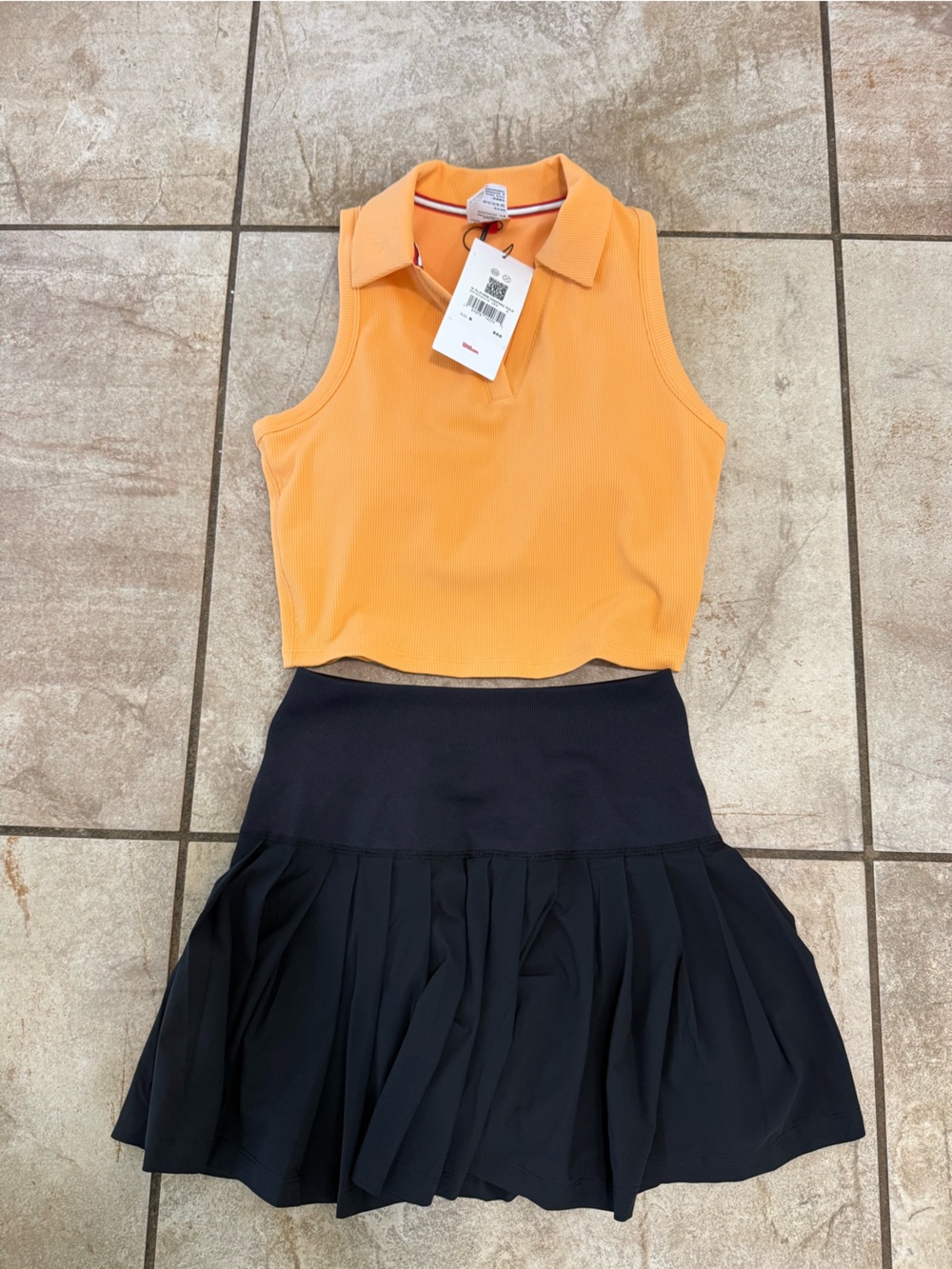Wilson Two-Tone Pleated Skirted Bodysuit in Black and Orange